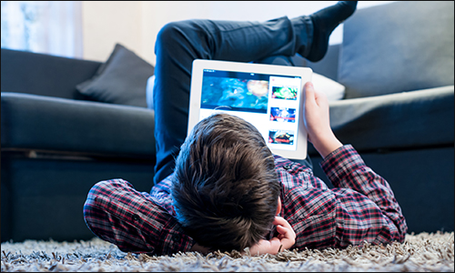 child viewing tablet computer