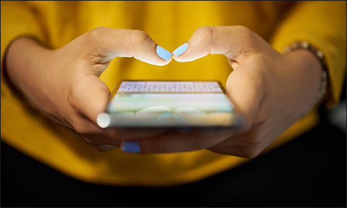 Hands holding smartphone