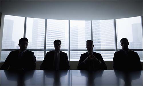 Silhouette row of businessmen sitting in meeting room