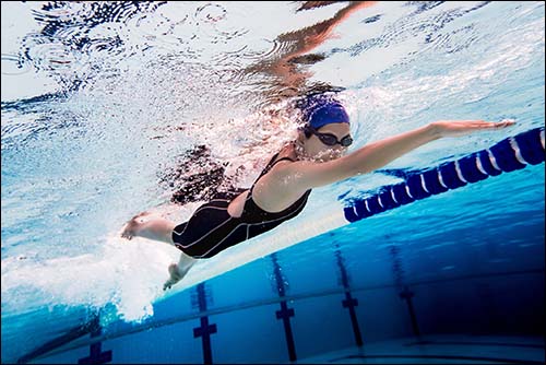 Woman swimming in pool